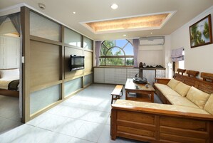 Exclusive Double Room, 2 Twin Beds | Living area | LCD TV