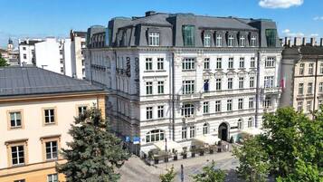 A historic building with classical architecture, featuring a prominent entrance and multiple windows.