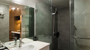 A modern bathroom with a glass-enclosed shower, a double sink vanity, and a large mirror. - Sao Bang Hotel (Hanoi)