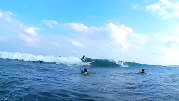 A beach scene with surfers and waves.