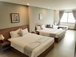 Family Room | Minibar, desk, free WiFi, bed sheets - An Hoi Canary Hotel (Da Nang)