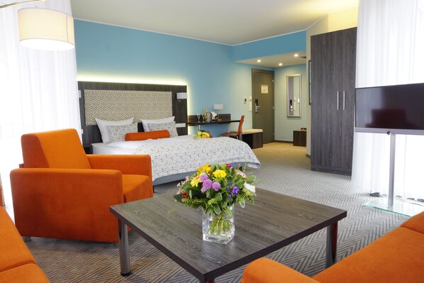 Premium bedding, desk, laptop workspace, blackout curtains