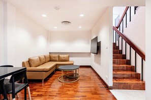 Family House, 2 Bedrooms, Poolside | Living area | 40-inch flat-screen TV with cable channels - Teja Hotel (Bangkok)