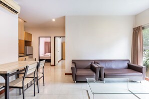Family Apartment, 2 Bedrooms | Living area | 40-inch flat-screen TV with cable channels