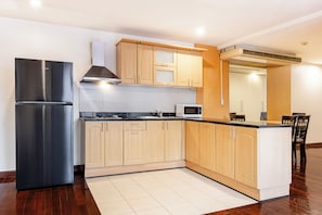 Family Apartment, 3 Bedrooms, City View | Private kitchen | Fridge, microwave, cookware/dishes/utensils, dining tables