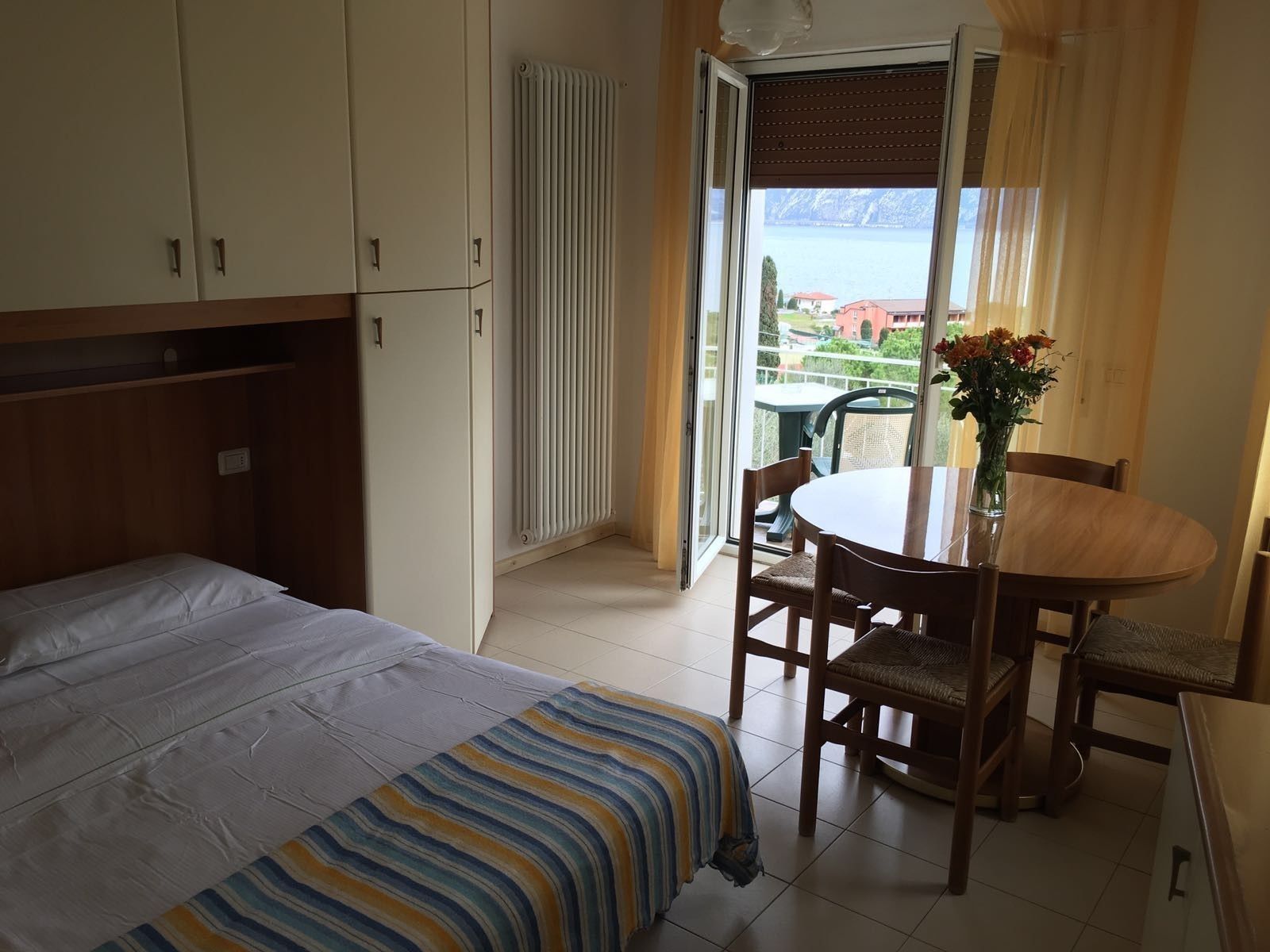 triple room, partial lake view | desk, free cots/infant beds, free wifi, bed sheets