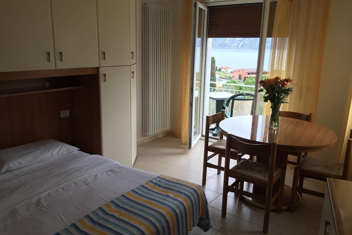 triple room, partial lake view | desk, free cots/infant beds, free wifi, bed sheets