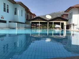Outdoor pool, pool umbrellas, sun loungers