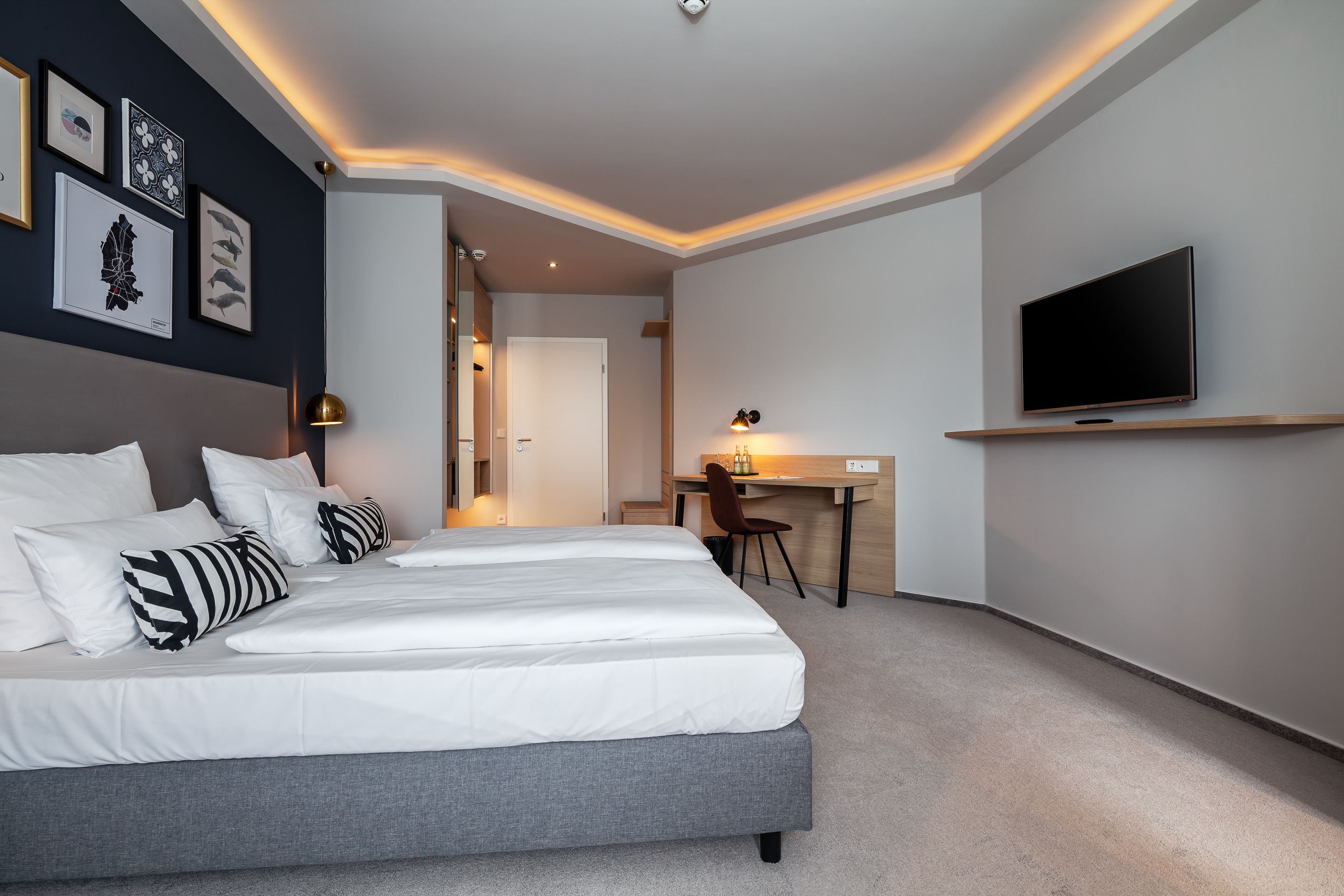 comfort double room | in-room safe, desk, laptop workspace, blackout curtains