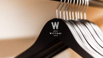 A close-up of a black hanger with the logo "WITTORF HOTEL" on it.