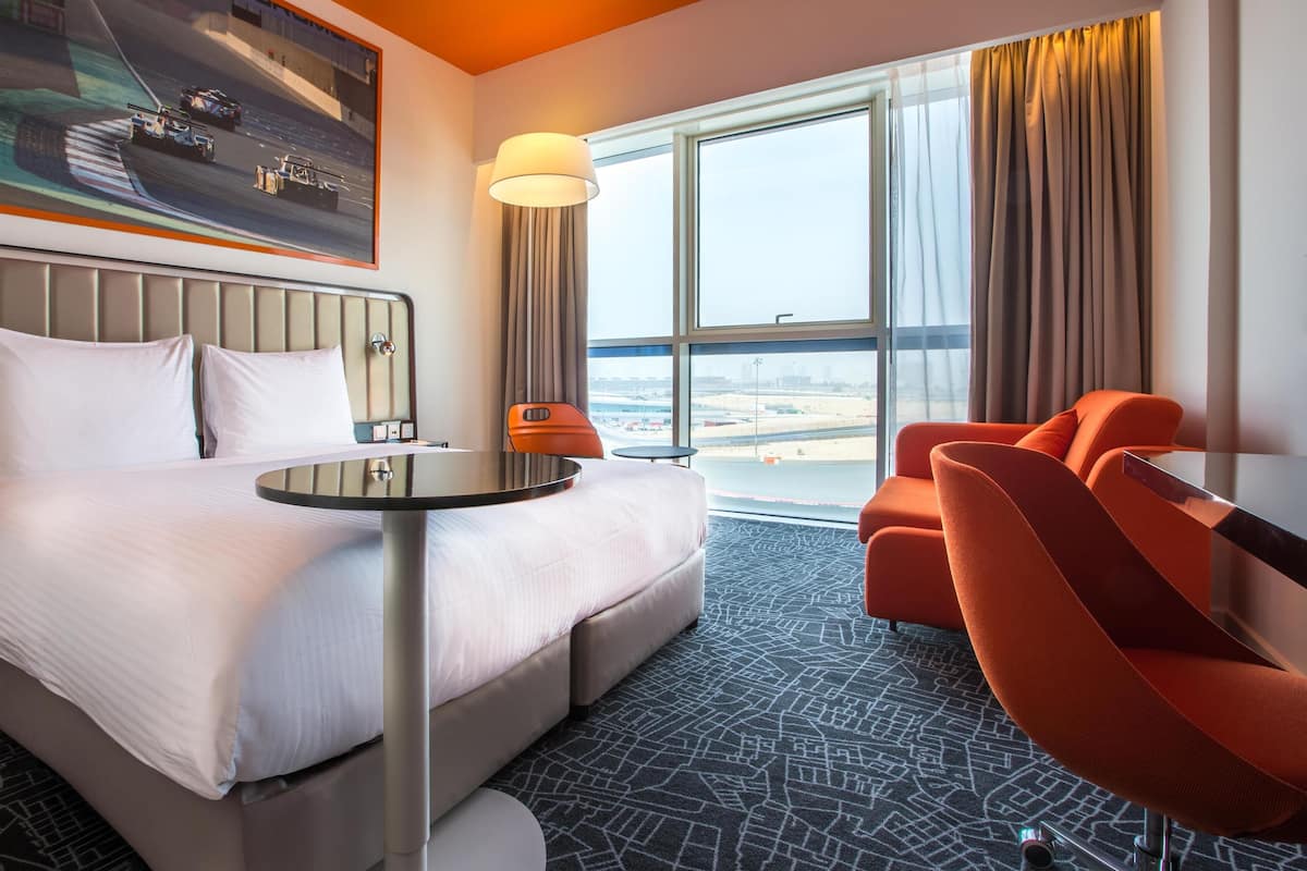 Superior Room (Autodrome Track View) | Minibar, in-room safe, desk, laptop workspace