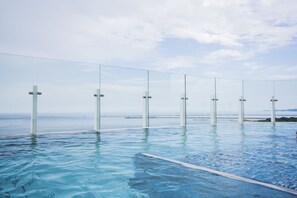 Outdoor pool, sun loungers, lifeguards on site