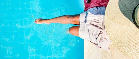 Outdoor pool, open 8:00 AM to 8:00 PM, pool loungers