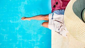 Outdoor pool, open 7:00 AM to 8:00 PM, pool umbrellas