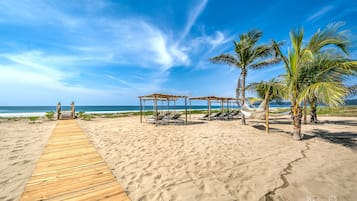 On the beach, free beach cabanas, sun loungers, beach volleyball