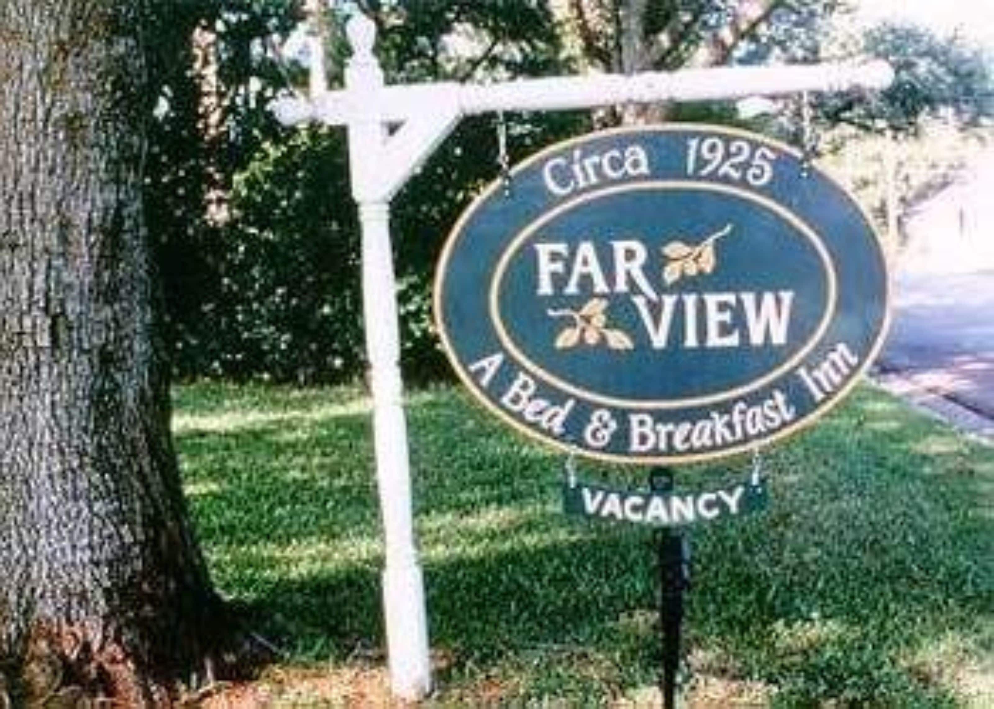 A vintage sign for Far View Inn, indicating it is a bed and breakfast since circa 1925, with a vacancy notice.