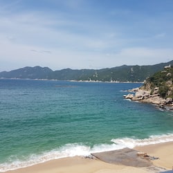 On the beach, sun-loungers, beach umbrellas, beach towels