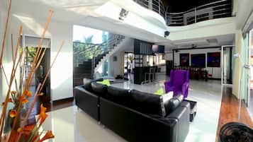 Luxury Villa | Living area | 55-inch flat-screen TV with cable channels, Smart TV, DVD player