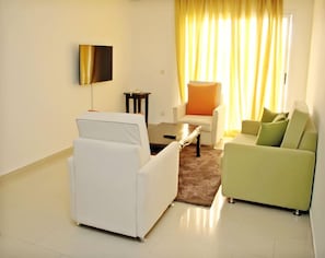 Superior Suite | Living area | Flat-screen TV