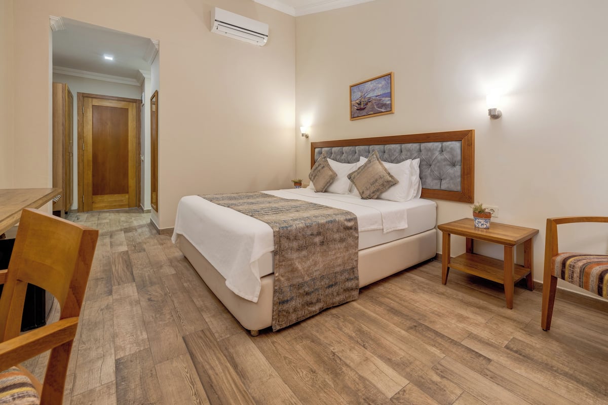 Standaard kamer, 1 twee- of 2 eenpersoonsbedden, uitzicht op tuin | Luxe beddengoed, Select Comfort-bedden, een minibar