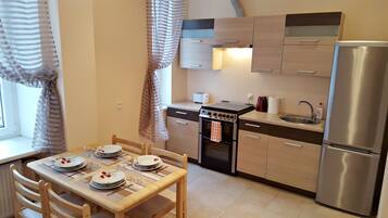 Family Apartment, 2 Bedrooms (Address: 11 Avotu street) | Private kitchen | Full-size fridge, stovetop, electric kettle, cookware/dishes/utensils