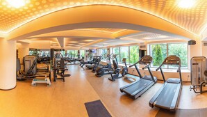 A gym with treadmills, elliptical machines, and weight equipment. - Grand Hotel Belvedere Brasov (Brasov)