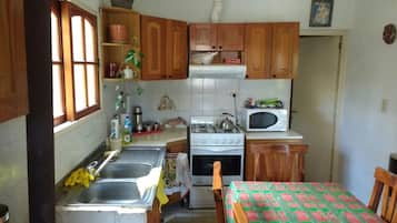 Cabin | Private kitchen | Full-sized fridge, microwave, oven, stovetop