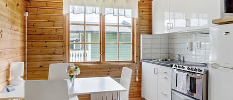 Bungalow, 2 Bedrooms | Private kitchen | Fridge, coffee/tea maker, cleaning supplies