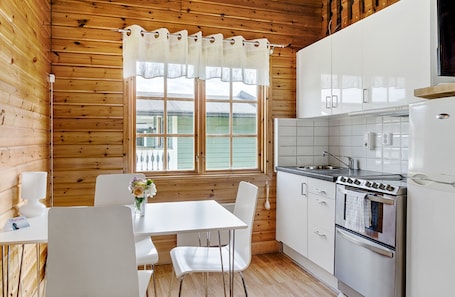 Bungalow, 2 Bedrooms | Private kitchen | Fridge, coffee/tea maker, cleaning supplies
