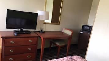 Desk, iron/ironing board, bed sheets