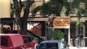 A hotel sign advertising overnight stay rates. - Herbies Mansion (Olongapo)