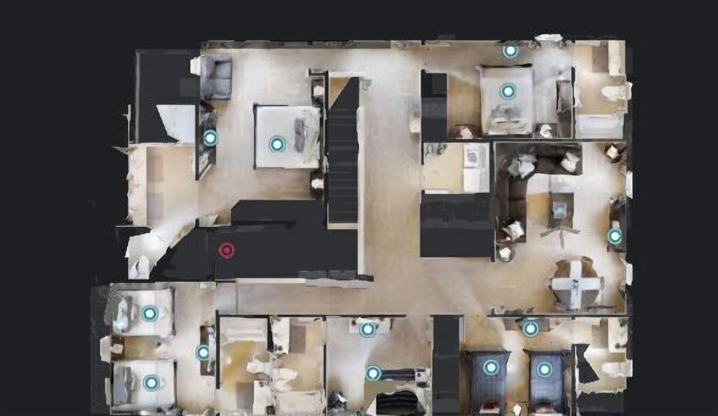 A hotel layout with multiple rooms, a central staircase, and a dining area.
