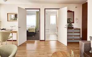 Suite, 1 Bedroom | Desk, blackout drapes, soundproofing, iron/ironing board
