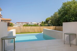 Relax by the pool surrounded by a tranquil atmosphere and scenic views.