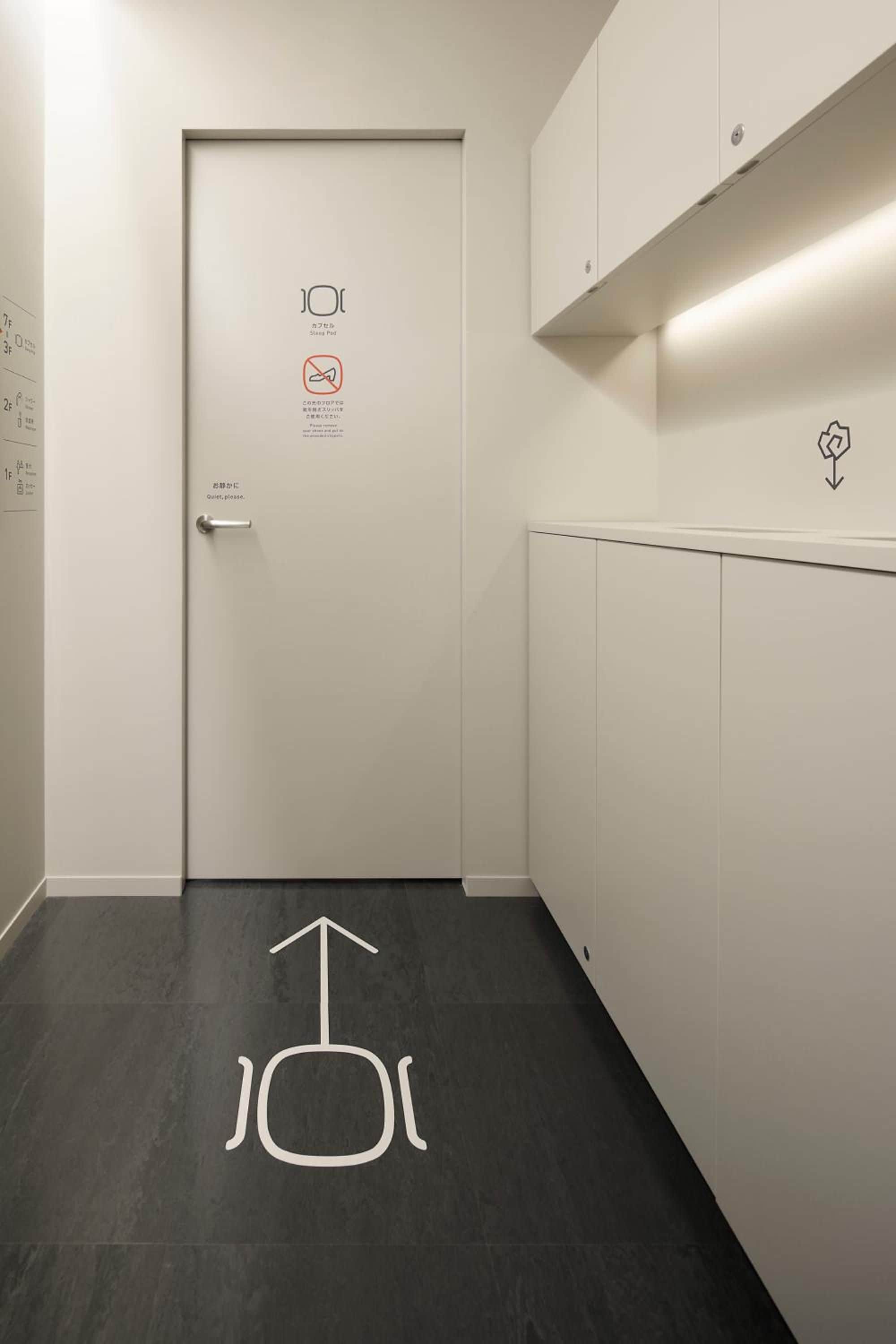 A hallway with a door marked 'Quiet please.'