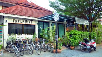 Early Bird offers a welcoming entrance with a covered area and potted plants.