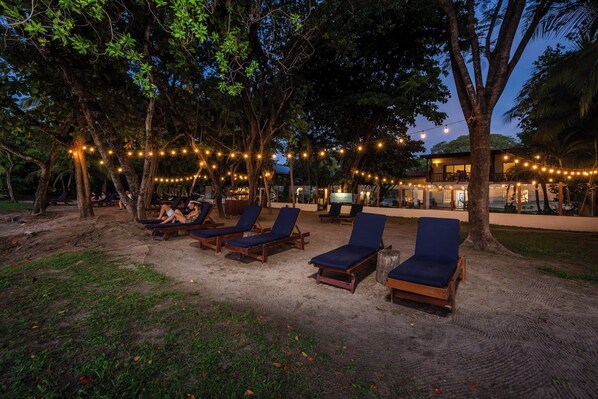 On the beach, sun loungers, beach towels