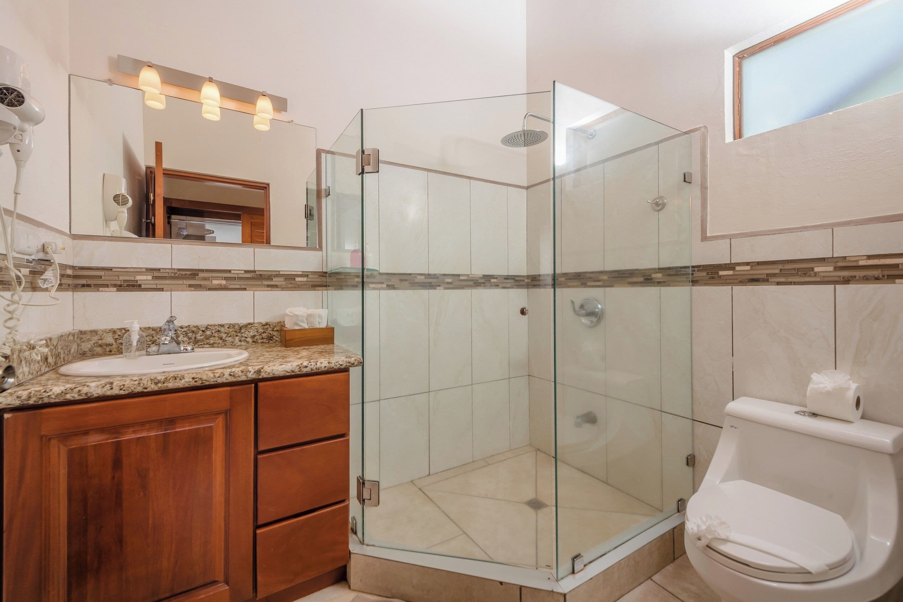 suite, beachfront | bathroom | shower, free toiletries, hair dryer, towels