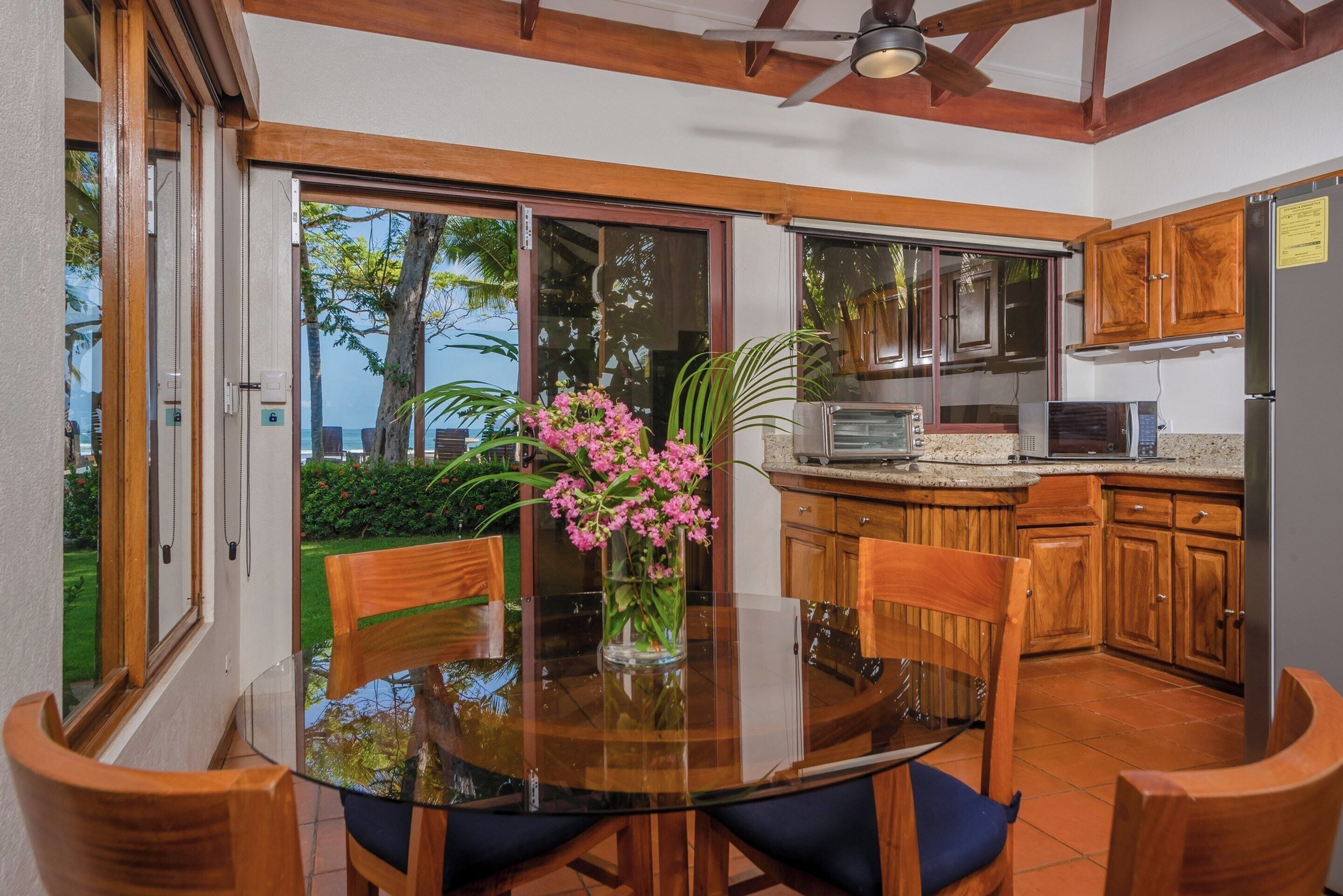 bungalow, beachfront | private kitchen | full-sized fridge, microwave, stovetop, coffee/tea maker