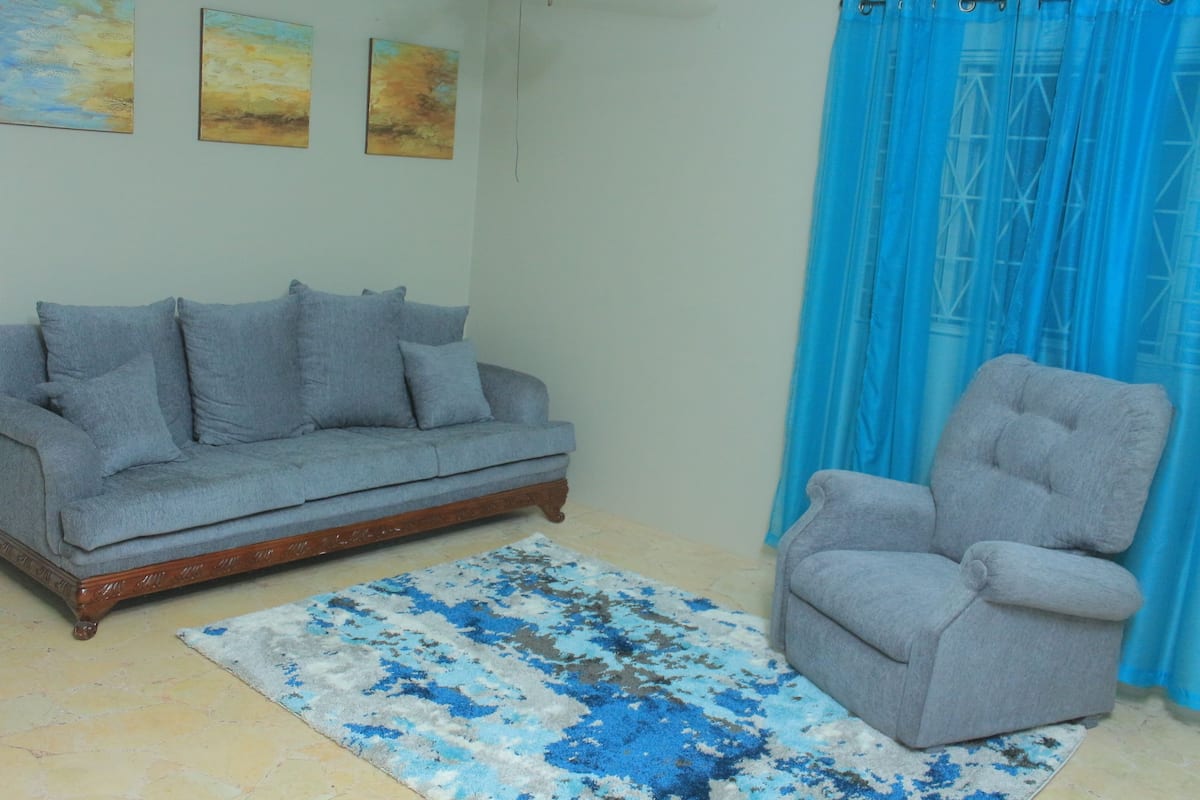 Design Apartment, 2 Bedrooms, City View, Corner | Living room | 50-inch flat-screen TV with cable channels, TV, DVD player