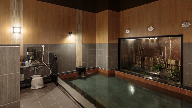 A modern bathroom with a large bathtub, a shower area, and a sink. - Hotel Route - Inn Takaoka Ekimae (Takaoka)