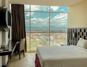 In-room safe, desk, blackout curtains, soundproofing - Grand Orchid Hotel Yogyakarta (Depok)
