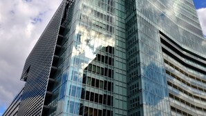 A modern skyscraper with a glass facade reflecting the sky. - KOKO HOTEL Higashiosaka (Higashi-osaka)