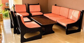 A room with a sofa set, a coffee table, and chairs. - Residence Diane (Ouagadougou)