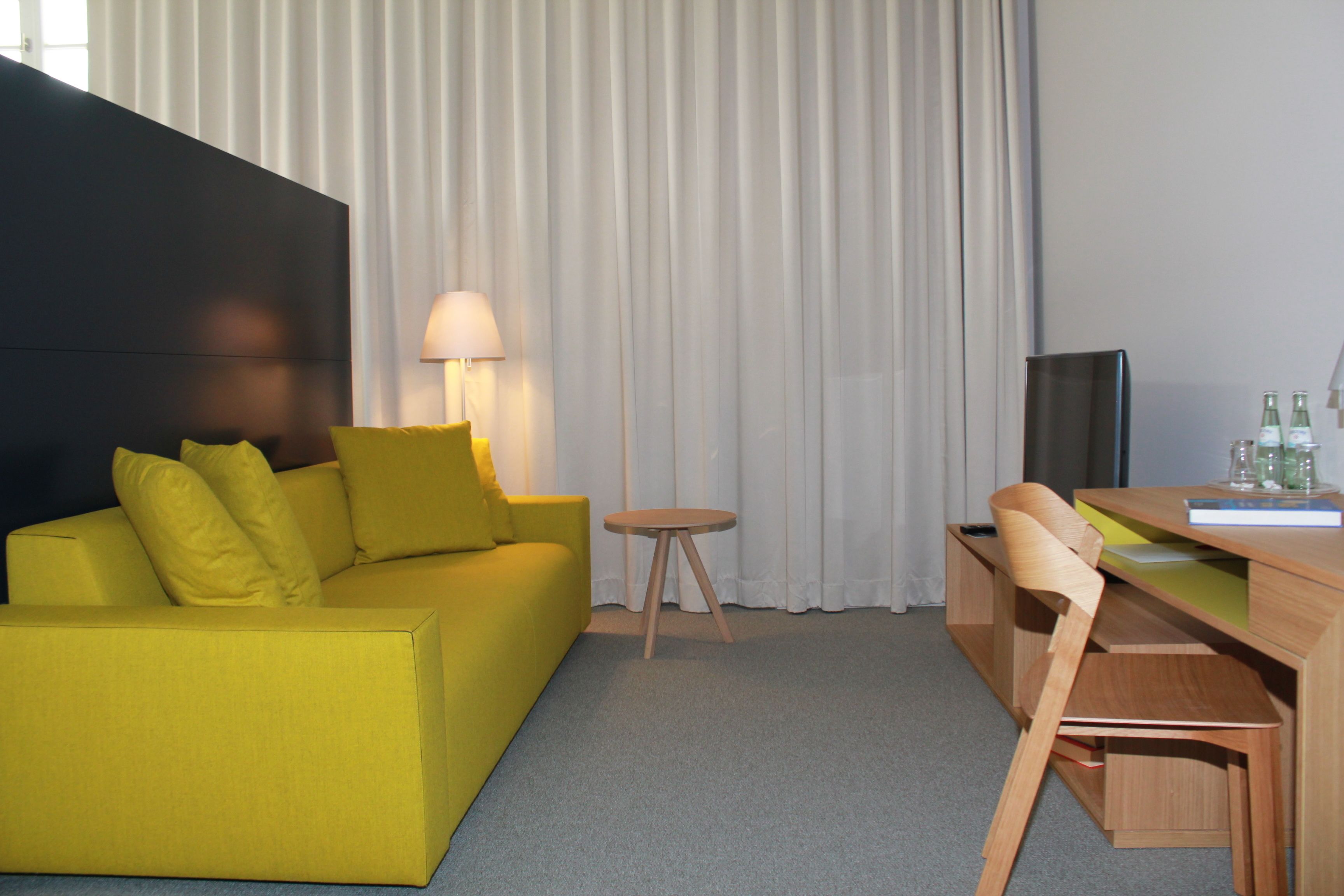 premium suite, city view | living area | flat-screen tv