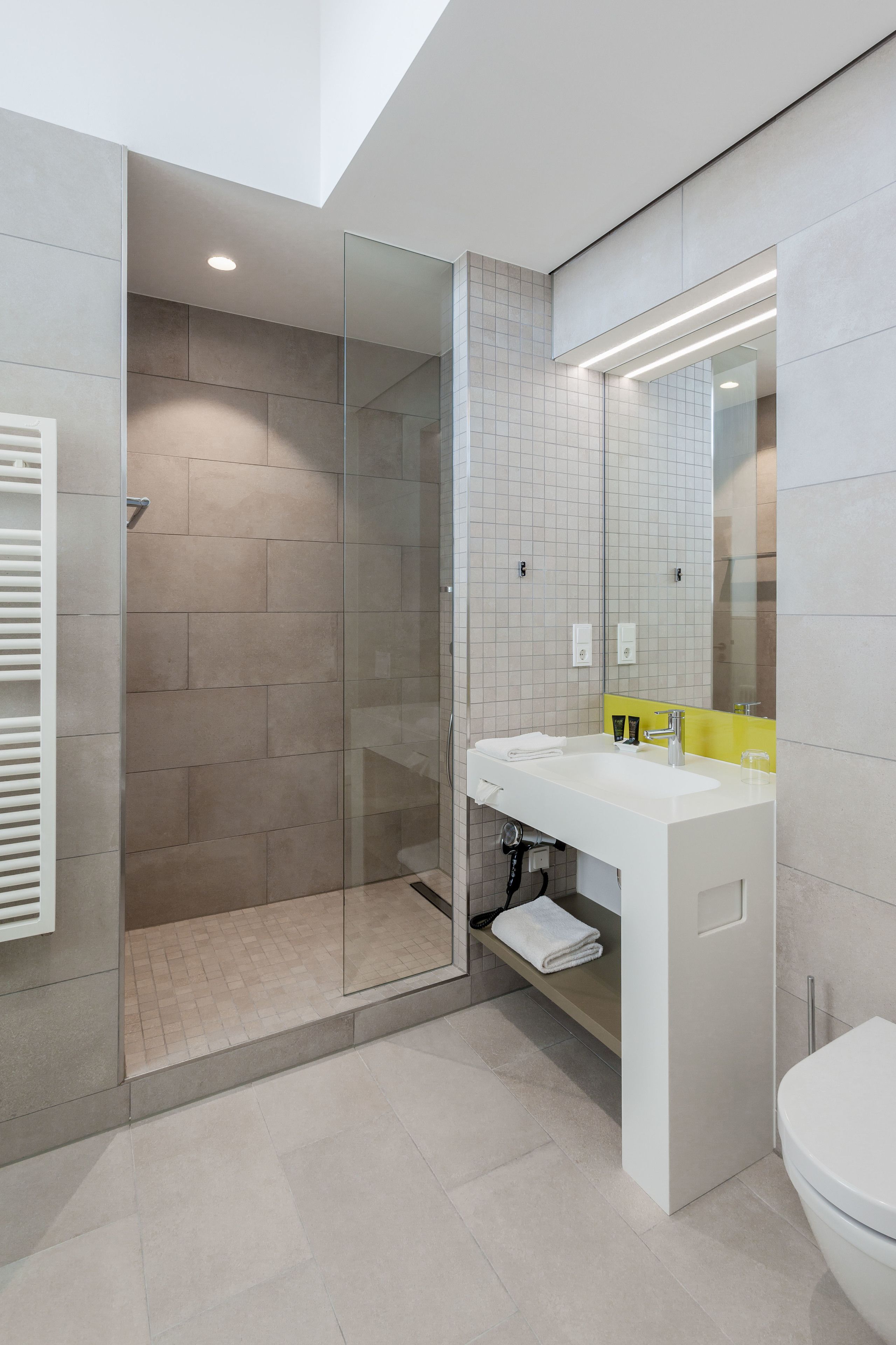 comfort double room, city view | bathroom | shower, free toiletries, hair dryer, towels