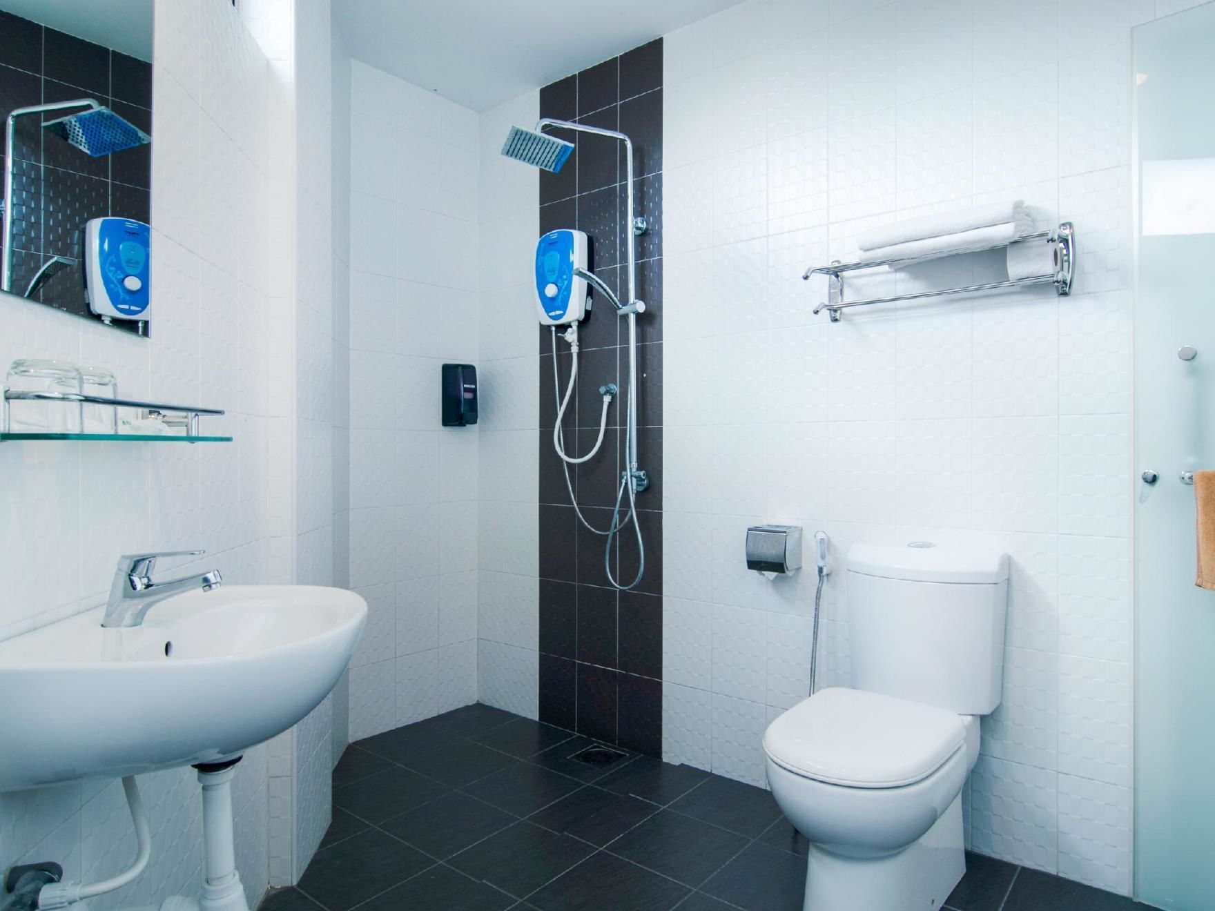 deluxe king bed room  | bathroom | shower, free toiletries, hair dryer, slippers