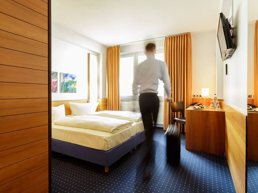 Standard Double or Twin Room | In-room safe, desk, laptop workspace, blackout drapes