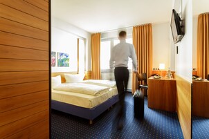 Standard Double or Twin Room | In-room safe, desk, laptop workspace, blackout drapes