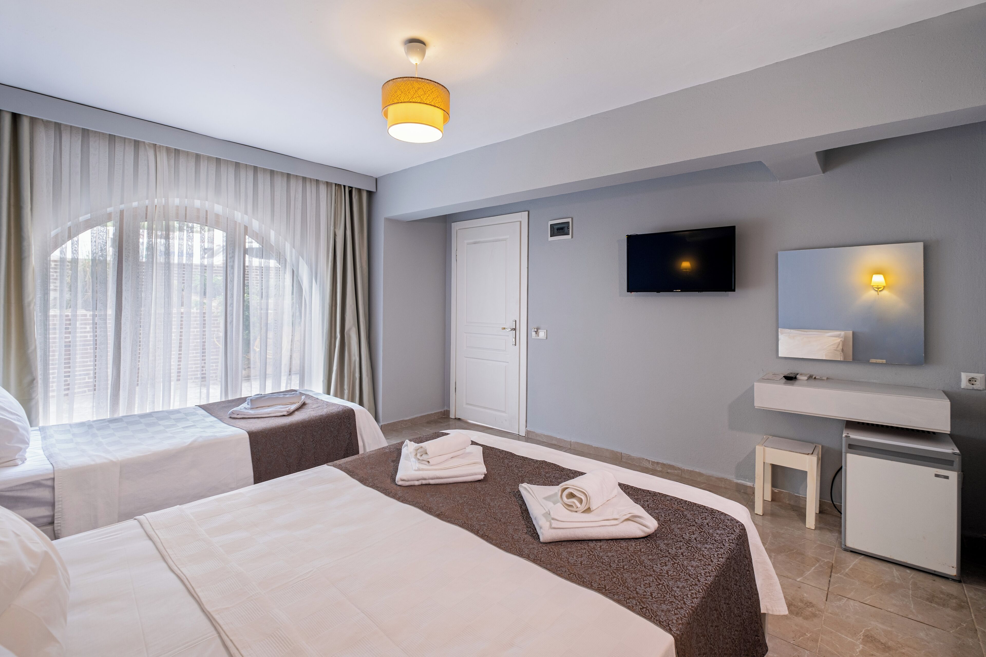 economy triple room, ground floor | 1 bedroom, minibar, free wifi, bed sheets